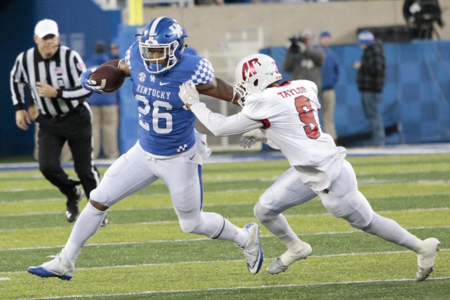 Kentucky running back Benny Snell Jr. runs by a defender during the game against Austin Peay on Saturday, November 19, 2016 in Lexington, Ky. Photo by Hunter Mitchell | Staff