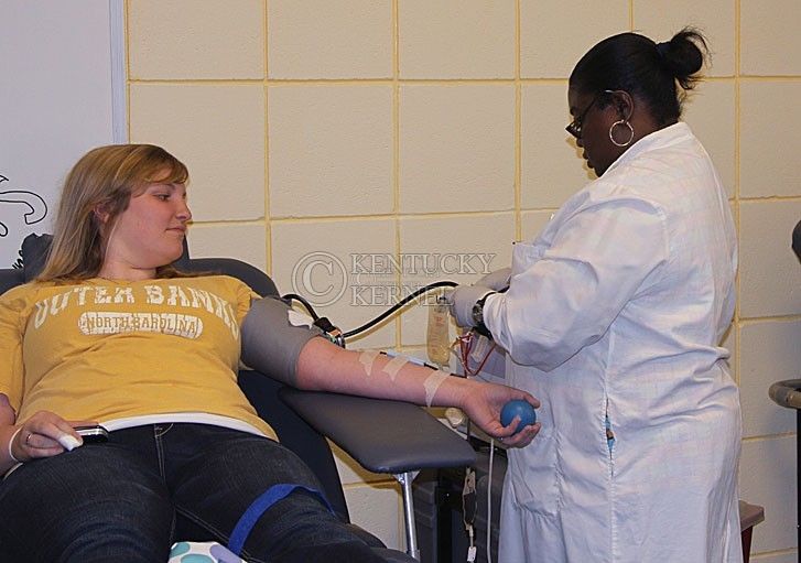 Special Education freshman Ashley Fisher, left, has blood drawn from a Blood Center nurse while Pre-Nursing freshman Lucy Jayes relaxes after hers was taken.