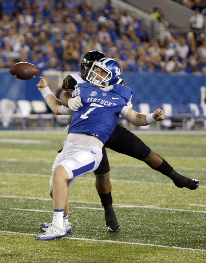 Kentucky quarterback Drew Barker is sacked during the football game against Southern Miss on Saturday, September 3, 2016 in Lexington, Ky. Photo by Hunter Mitchell | Staff
