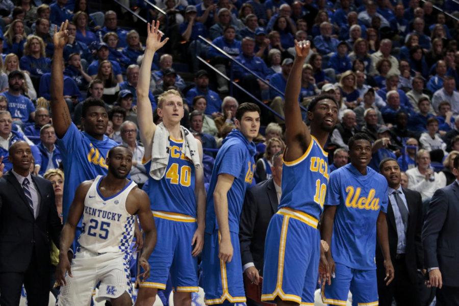The UCLA bench watches as Isaac Hamilton lets a three fly during the Wildcats game against the UCLA Bruins at Papa Johns Stadium on December 3, 2016 in Louisville, Kentucky.
