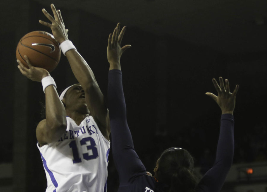 Junior forward Evelyn Akhator (13) drives the ball in traffic during the game against the Auburn Tigers on Sunday, January 17, 2016 in Lexington,. Kentucky won the game 54-47. Photo by Hunter Mitchell | Staff