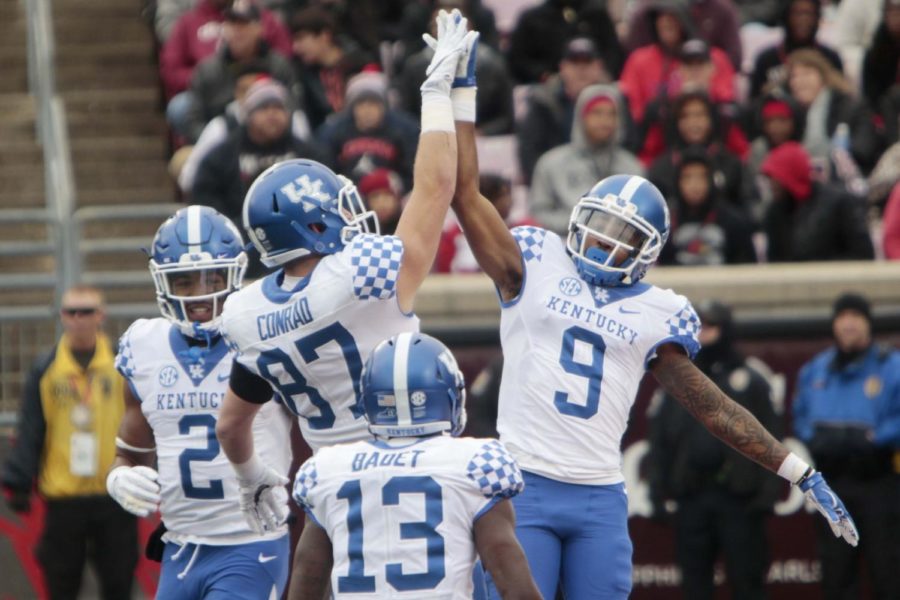 Garrett Johnson and C.J. Conrad celebrate after a scored touchdown during the game against the Louisville Cardinals on Saturday, November 26, 2016 in Lexington, Ky. Photo by Hunter Mitchell | Staff