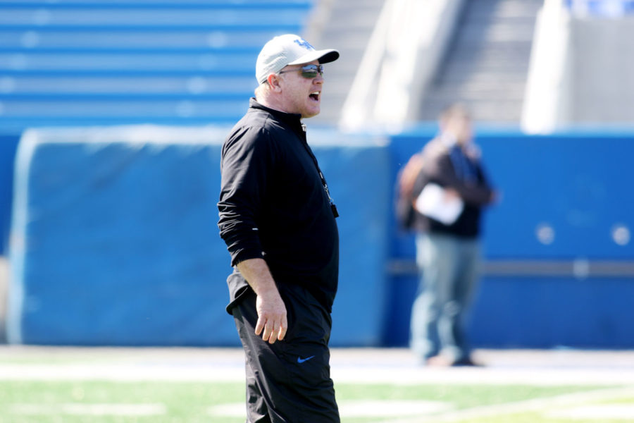 Mark Stoops acting as a referee during the first open practice of the season at Commonwealth Stadium in Lexington, Ky. on Saturday, March 26, 2016. Photo by Josh Mott | Staff.