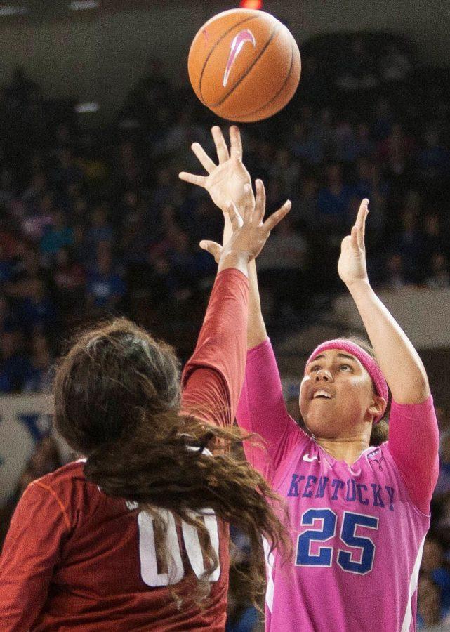 Junior guard Makayla Epps (25) shoots the ball over a defender during the game against the Arkansas Razorbacks on Sunday, February 21, 2016 in Lexington, Ky. Kentucky won the game 77-63. Photo by Hunter Mitchell | Staff