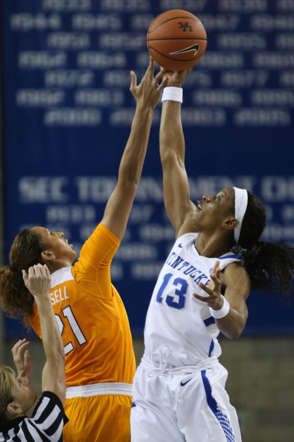 Junior forward Evelyn Akhator (13) jumps for the ball for the opening tip before the game against the Tennessee Volunteers on Monday, January 25, 2016 in Lexington, Ky. Kentucky won the game 64-63. Photo by Hunter Mitchell | Staff