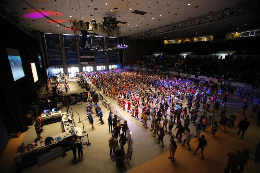 Students kick off the 16th hour of DanceBlue with a line dance at Memorial Coliseum in Lexington, Ky., on Sunday, February 26, 2017. Photo by Joshua Qualls | Staff