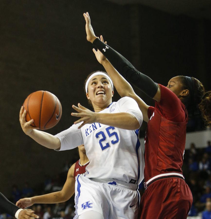 Kentucky Wildcats guard Makayla Epps fights through contact to shoot a layup during the second half of the game against the South Carolina Gamecocks on Thursday, February 2, 2017 at Memorial Coliseum in Lexington, KY. Photo by Addison Coffey | Staff.