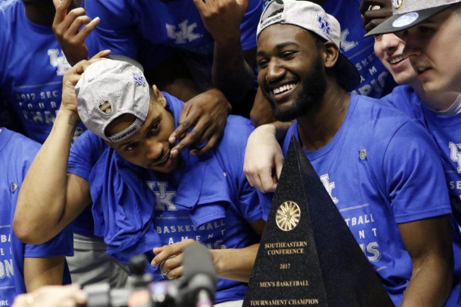 Senior guard Dominique Hawkins smiles with the SEC Championship Trophy after the championship game of the SEC Tournament against the Arkansas Razorbacks on Sunday, March 12, 2017 in Nashville, Ky. Kentucky won the game 82-65 to win their third-straight SEC Championship.