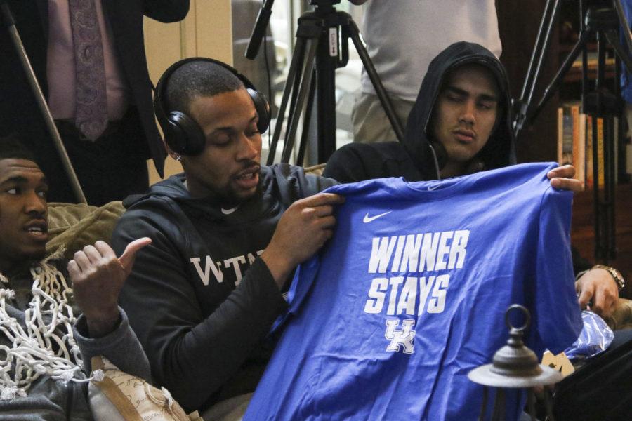 Isaiah Briscoe shows off the teams new t-shirts for the postseason during the NCAA Tournament Selection Show on Sunday, March 12, 2017 in Lexington, KY. Photo by Addison Coffey | Staff.