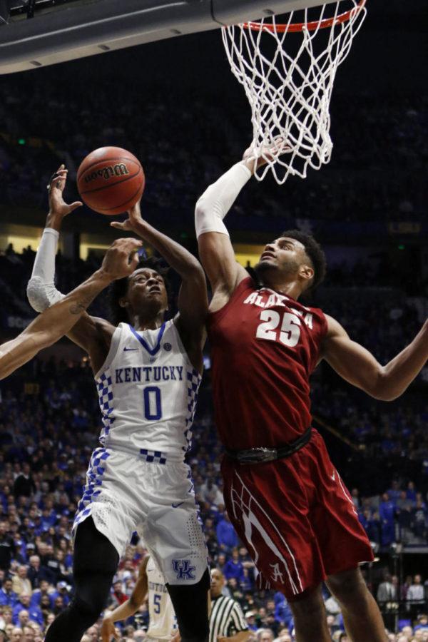 Freshman guard DeAaron Fox (0) is fouled during the semifinal game of the SEC Tournament against the Alabama Crimson Tide on Saturday, March 11, 2017 in Nashville, Ky. Kentucky won the game 79-74.