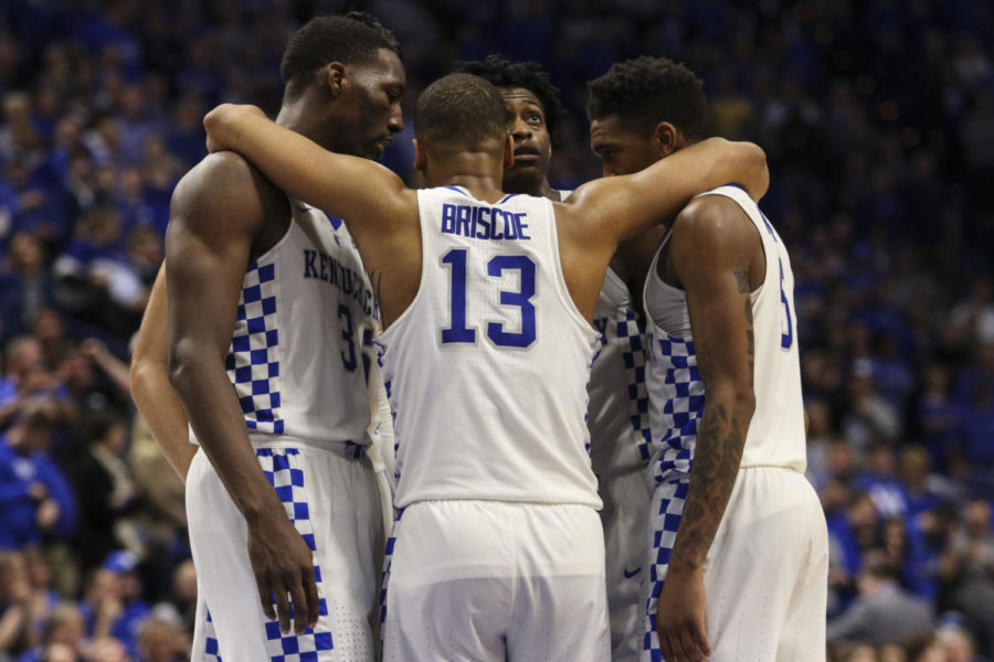Kentucky guard Isaiah Briscoe hugs his teammate in the huddle during the Wildcats game against the Vanderbilt Commodores at Rupp Arena on February 28, 2017 in Lexington, Kentucky.