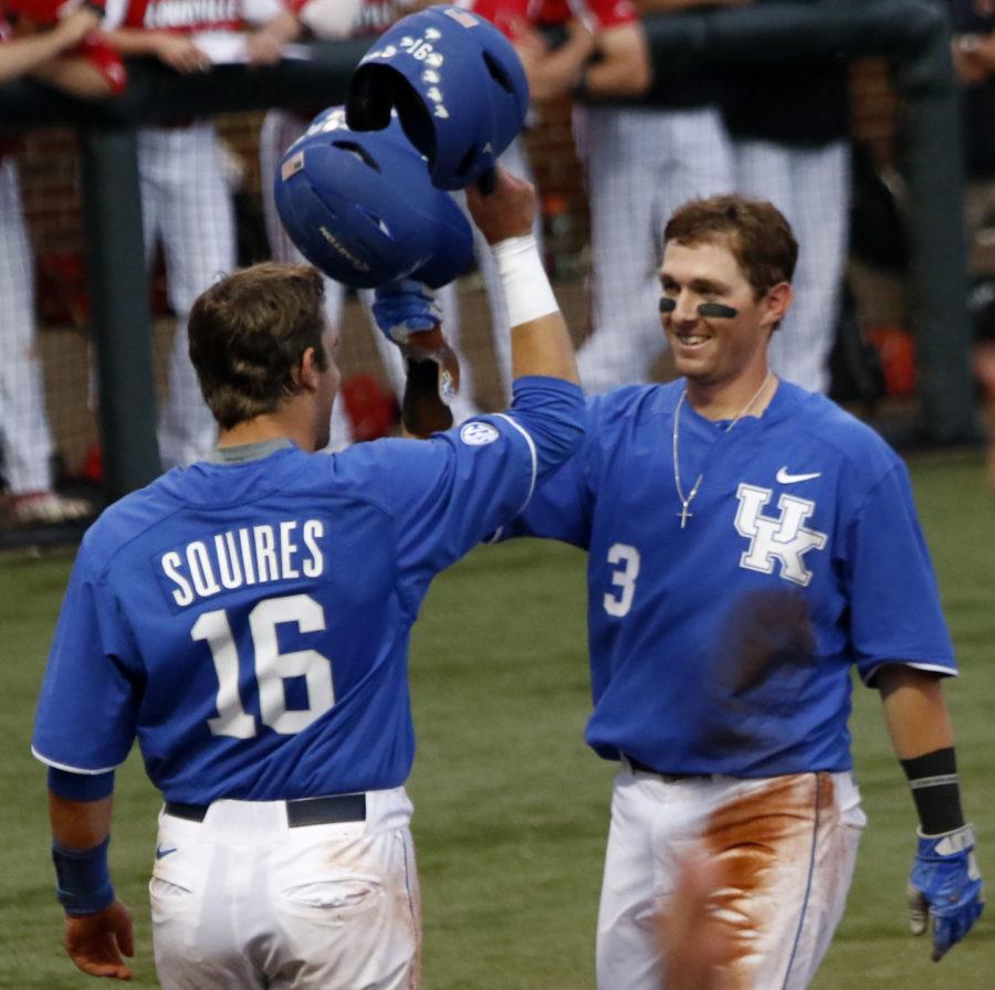 Tyler Marshall (3) celebrates a run with catcher Troy Squires (16) during the game against the Louisville Cardinals on Tuesday, April 18, 2017 in Lexington, Ky. Kentucky defeated Louisville 11-7.