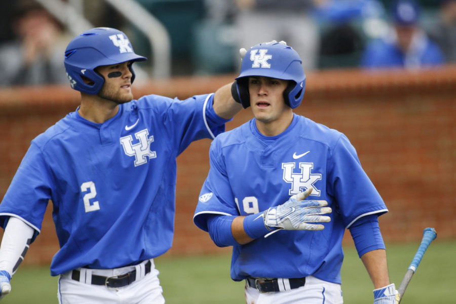 Kentucky Wildcats infielder Riley Mahan celebrates with first baseman Evan White after scoring a run during the game against the Vanderbilt Commodores at Cliff Hagan Stadium on Saturday, April 1, 2017 in Memphis, KY. Photo by Addison Coffey | Staff.