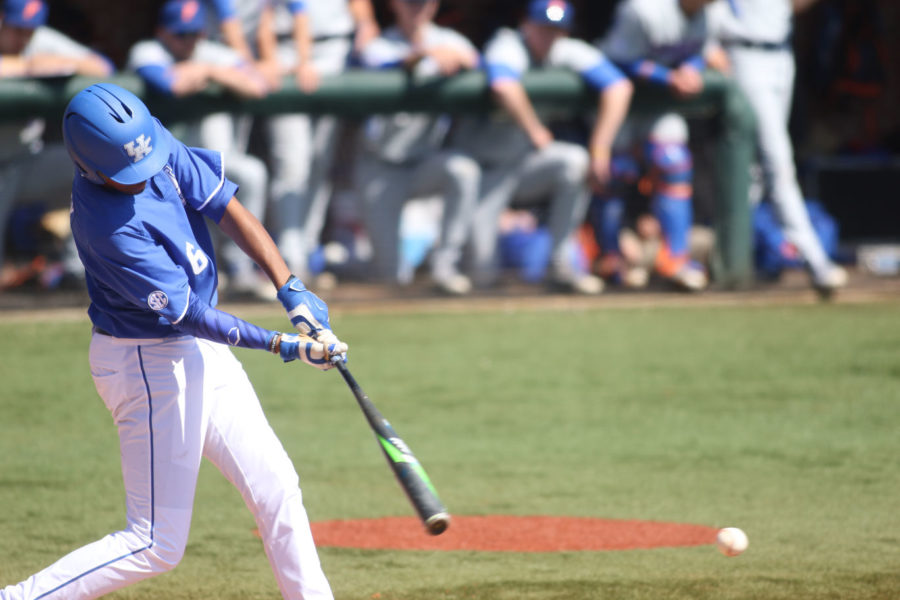 Tristan Pompey swings low for a breaking ball during the game against the Florida Gators Cliff Hagan Stadium in Lexington, Kentucky on Saturday, March 26, 2016.