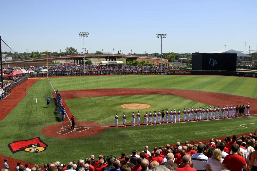 The+Kentucky+Wildcats+and+the+Louisville+Cardinals+stand+for+the+National+Anthem+prior+to+the+first+game+of+2017+NCAA+Division+I+Mens+Baseball+Super+Regional+at+Jim+Patterson+Stadium+on+Friday%2C+June+9%2C+2017+in+Louisville%2C+KY.+Photo+by+Addison+Coffey+%7C+Staff.