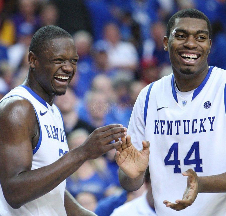 Kentucky Wildcats forward Julius Randle (30) and Kentucky Wildcats center Dakari Johnson (44) celebrate after head coach John Calipari puts second string players in with one minute left to play at UK mens basketball vs. Georgia at the SEC Tournament at the Georgia Dome in Atlanta, Ga., on Saturday, March 15, 2014. Kentucky defeated Georgia 70-58. Photo by Emily Wuetcher