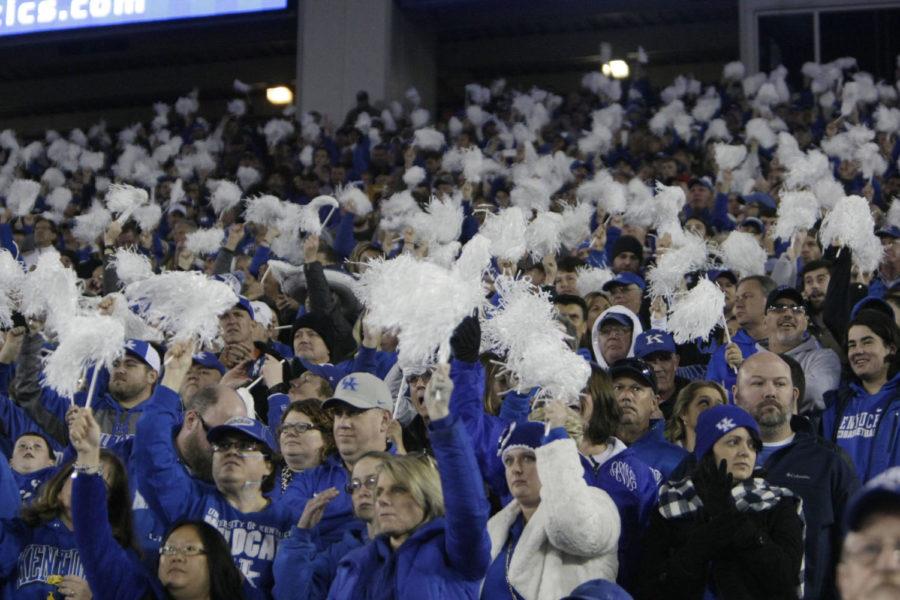 Fans hold pom-poms in the air and cheer during the game against Georgia on Saturday, November 5, 2016 in Lexington, Ky. Photo by Hunter Mitchell | Staff
