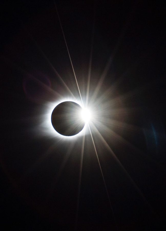 The diamond ring phase of the total solar eclipse as seen from an Amish farm in Cerulean, Ky., on Monday, Aug. 21, 2017. The vantage point was host to hundreds of spectators and NASA, chosen because of the duration of totality which began at 1:25 p.m. CDT. Photo by Arden Barnes | Staff
