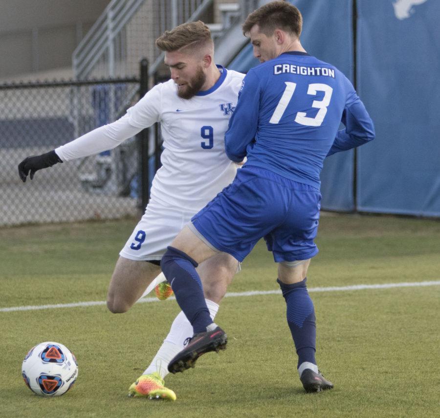 Junior Andrew Mckelvey passes the ball along the end line during the game against Creighton on Sunday, November 20, 2016 in Lexington, Ky. Kentucky lost the match 3-2. Photo by Carter Gossett | Staff