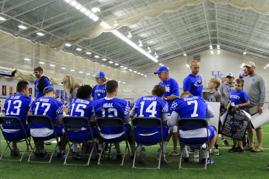 Fans wait in line to get autographs from the quarterbacks during fan day at the Joe Craft Football Training Facility on Saturday, August 5, 2017 in Lexington, KY. Photo by Addison Coffey | Staff