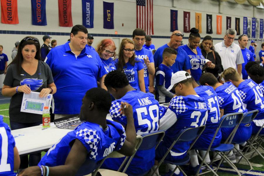 Fans wait in line to get autographs from the line backers during fan day at the Joe Craft Football Training Facility on Saturday, August 5, 2017 in Lexington, KY. Photo by Addison Coffey | Staff