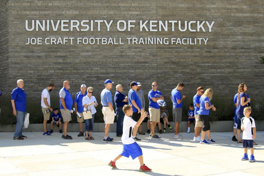 Two+young+fans+play+catch+while+fans+wait+in+line+for+the+open+practice+at+the+Joe+Craft+Football+Training+Facility+on+Saturday%2C+August+5%2C+2017+in+Lexington%2C+KY.+Photo+by+Addison+Coffey+%7C+Staff