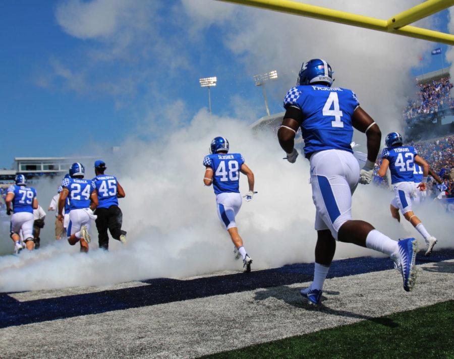 The University of Kentucky Football Team runs out of the tunnel before the game against EKU on Saturday, September 9, 2017 in Lexington, Ky. Kentucky defeated EKU 27 to 16. Photo by Kaitlyn Gumm| Staff