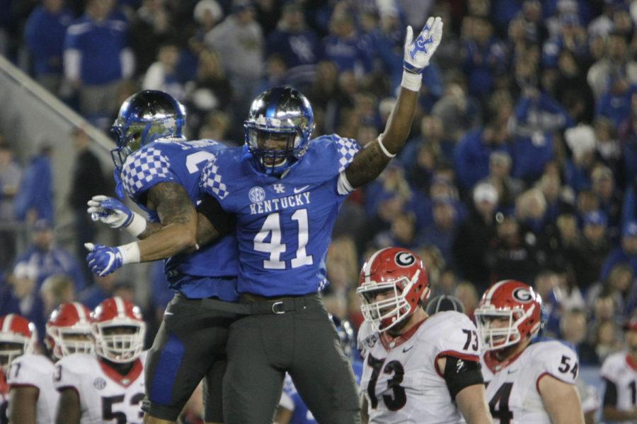 Kentucky linebackers Jordan Jones and Josh Allen celebrate after a tackle during the game against Georgia on Saturday, November 5, 2016 in Lexington, Ky. Photo by Hunter Mitchell | Staff