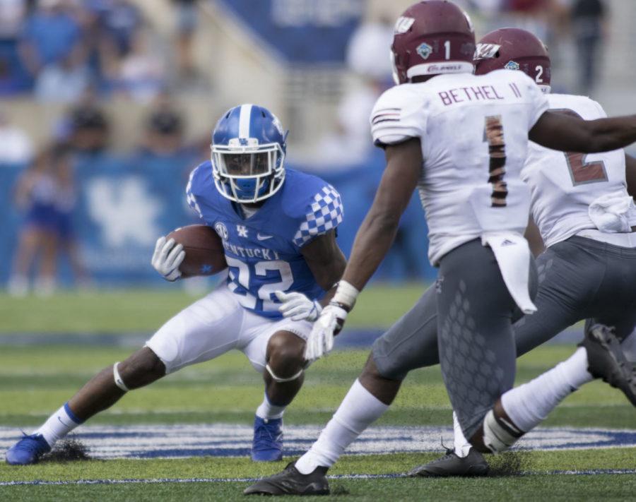 Sihiem King #22 of the Kentucky Wildcats jukes Nigel Bethel #1 of the Eastern Kentucky Colonels and another defender during the game against EKU on Saturday, September 9, 2017 in Lexington, Ky. Kentucky defeated EKU 27-16. Photo by Carter Gossett | Staff