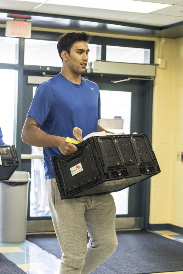 Tai Wynyard visits Picadome Elementary school with other members of the University of Kentucky mens basketball team on Friday, Sept. 15, 2017 in Lexington, Kentucky. The visit is part of UK Athletics Gods Pantry program providing food-filled grocery bags to kids across Fayette County. Photo by Arden Barnes | Staff