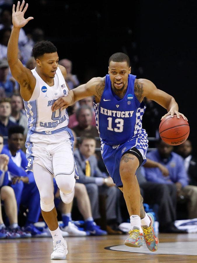 Kentucky Wildcats guard Isaiah Briscoe drives up the court against North Carolina Tar Heels guard Nate Britt during the 2017 NCAA Men's Basketball Tournament South Regional Elite 8 at FedExForum in Memphis, TN on Friday March 24, 2017. Photo by Michael Reaves | Staff