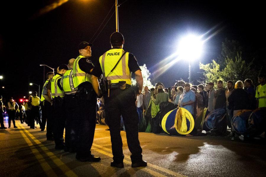 Police make a line down Avenue of Champions, separating UK basketball fans from the lawn outside Memorial Coliseum on Wednesday, September 27, 2017, in Lexington, Kentucky. Fans camp out to buy tickets to secure their spot to Big Blue Madness which will be held on Friday October 13, 2017, at Rupp Arena as the beginning to the 2017-2018 basketball season. Photo by Arden Barnes | Staff
