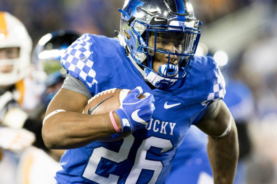 Kentucky Wildcats running back Benny Snell Jr. runs to the in zone scoring a touchdown during the game against Tennessee at Kroger Field on Saturday, October 28, 2017 in Lexington, Ky. Kentucky won 29 to 26. Photo by Arden Barnes | Staff