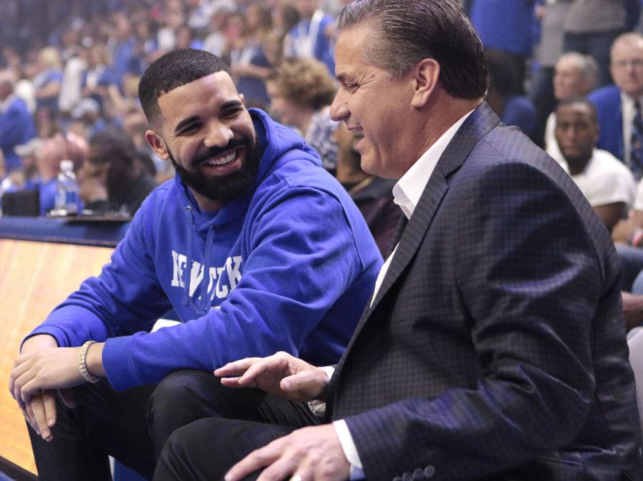 Rapper Drake and head coach John Calipari laugh on the bench during Big Blue Madness on Friday, October 13, 2017 in Lexington, Ky. Photo by Carter Gossett | Staff