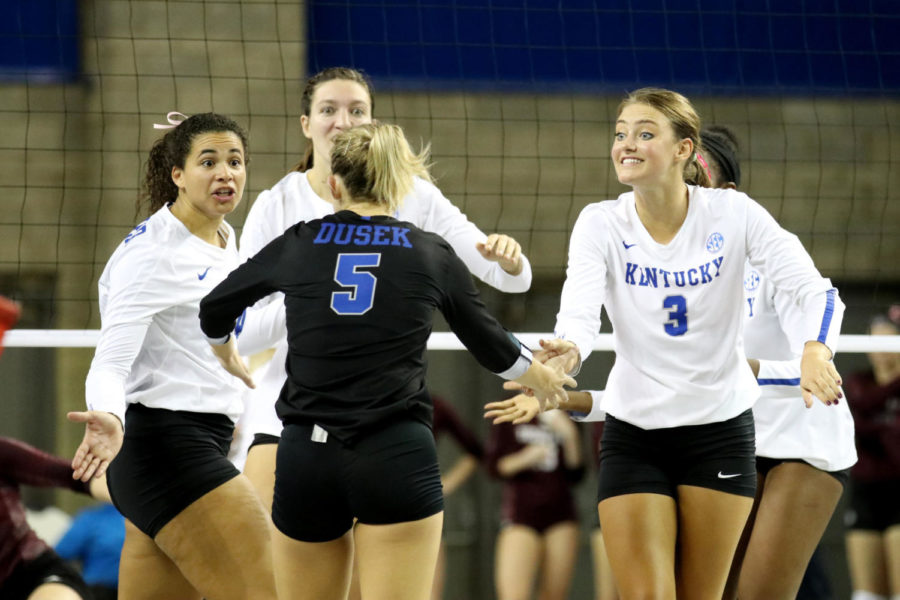 Avery Skinner, Ashley Dusek, and Madison Lilley celebrate a point during the match against Texas A&M on Wednesday, October 11, 2017 in Lexington, Ky. Kentucky won 3-0. Photo by Chase Phillips | Staff