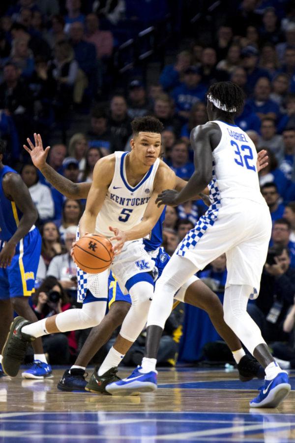 Kentucky freshman forward Kevin Knox passes the ball to sophomore forward Wenyen Gabriel during the Kentucky Cares Classic charity game against Morehead State at Rupp Arena on Monday, October 30, 2017 in Lexington, Ky. Photo by Arden Barnes | Staff