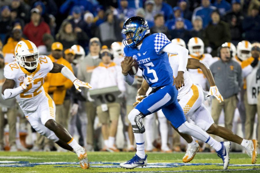 Kentucky Wildcats quarterback Stephen Johnson runs the ball down the field during the game against Tennessee at Kroger Field on Saturday, October 28, 2017 in Lexington, Ky. Kentucky won 29 to 26. Photo by Arden Barnes | Staff