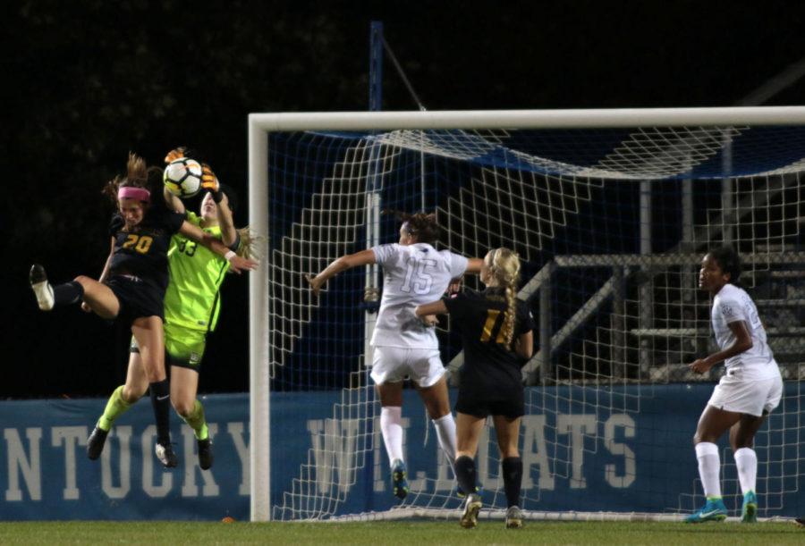 Sophomore goalkeeper Evangeline Soucie catches the ball in midair during the game against Missouri on Thursday, October 12, 2017 in Lexington, Ky. UK was defeated 2 to 1. Photo by Kaitlyn Gumm| Staff