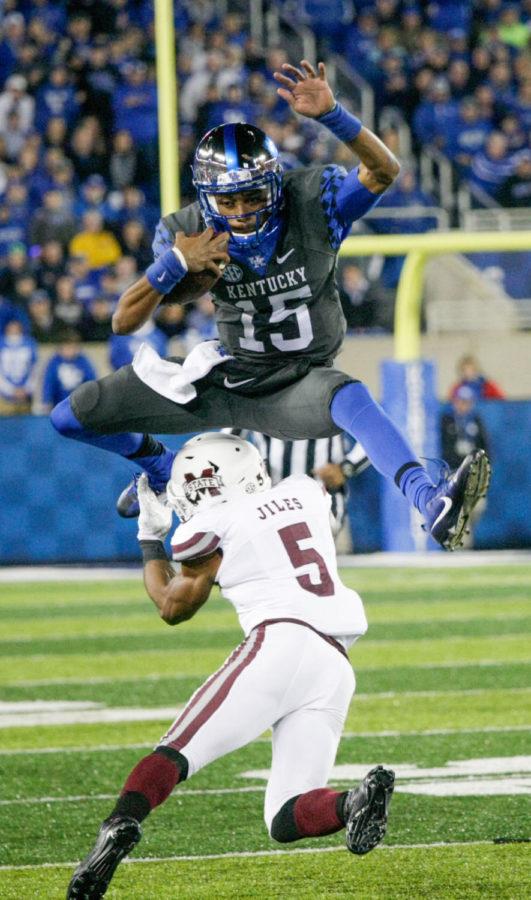 Kentucky quarterback Stephen Johnson hurdles over Mississippi State during the game against Mississippi State at Commonwealth on Saturday, October 22, 2016 in Lexington, Ky. Kentucky defeated Mississippi State 40-38. Photo by Lydia Emeric | Staff 