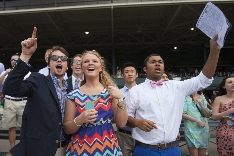Students cheer for their horse to win at Keeneland Race Course in Lexington , Ky.,on Friday, April 4, 2014. Photo by Michael Reaves | Staff 