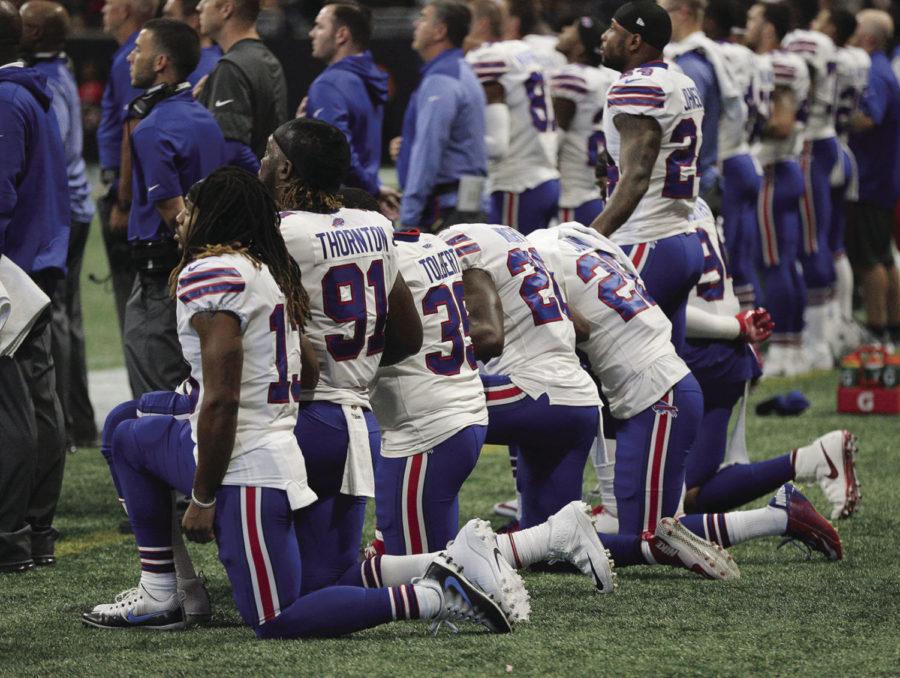 Many+of+the+Buffalo+Bills+players+kneel+on+the+sidelines+for+the+national+anthem+against+the+Atlanta+Falcons+on+Sunday%2C+Oct.+1%2C+2017%2C+in+Atlanta%2C+Ga.+%28Curtis+Compton%2FAtlanta+Journal-Constitution%2FTNS%29