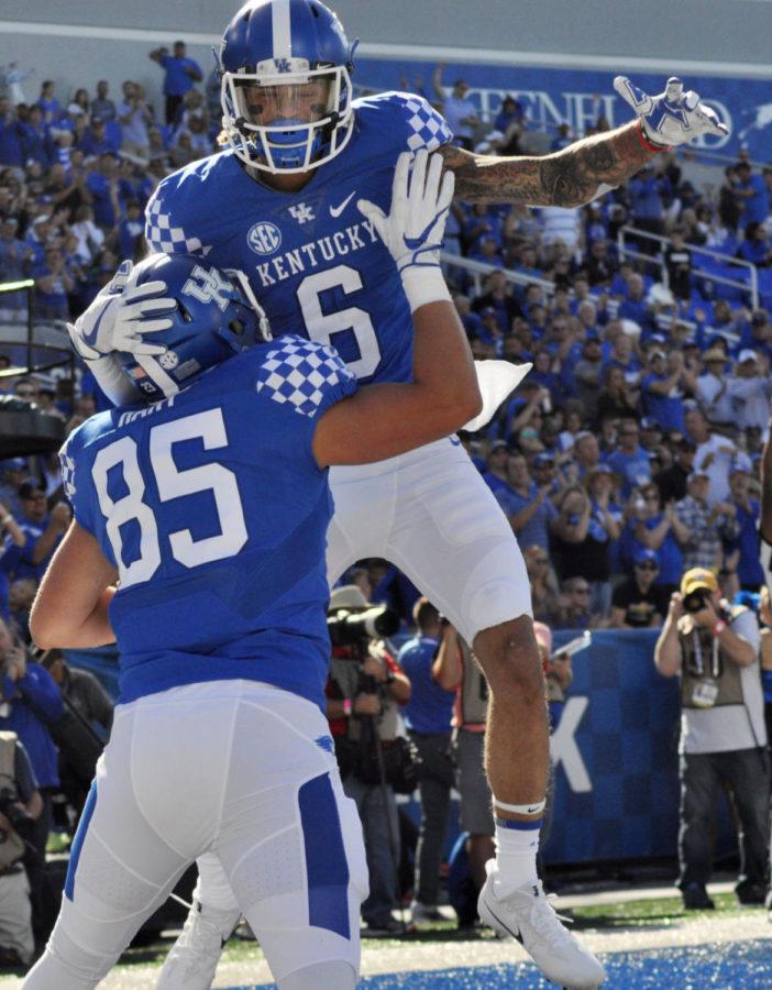 Kentucky tight end Greg Hart and Kentucky cornerback Lonnie Johnson celebrate Harts touchdown during the game against Eastern Michigan on Saturday. September 30, 2017 in Lexington, Kentucky. The Cats. Photo by Akintunde Nelson | Staff