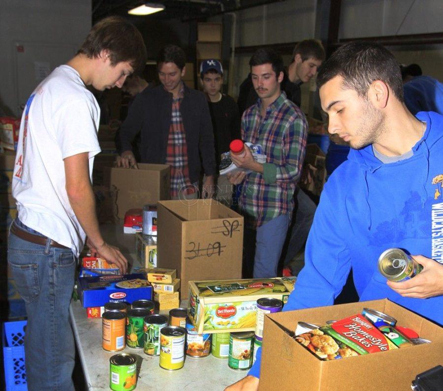 ATO sorts food for the needy at Gods Pantry in November 2013.