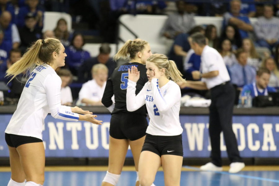 Gabby Curry and McKenzie Watson celebrate a point during the match against Florida on Wednesday, November 1, 2017 in Lexington, Ky. Kentucky lost 3-0. Photo by Chase Phillips | Staff