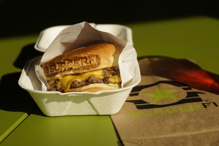 Burgerfis logo is branded into the top of each bun like a seal of approval. Burgerfi is located at the corner of Rose and Euclid on UKs campus. Photo by Mark C. Walsh | Staff