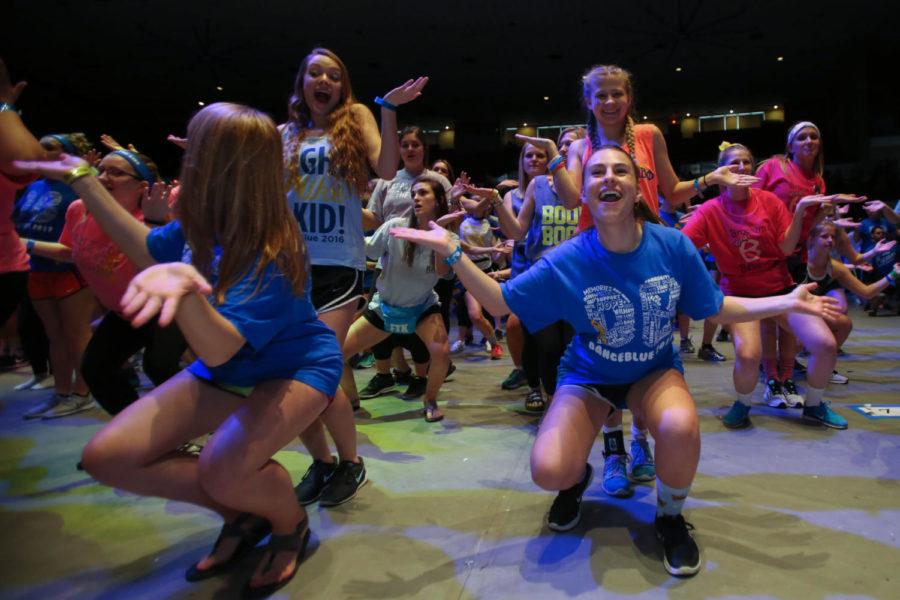 Students kick off the 14th hour of DanceBlue with a line dance at Memorial Coliseum in Lexington, Ky., on Sunday, February 26, 2017. Photo by Joshua Qualls | Staff