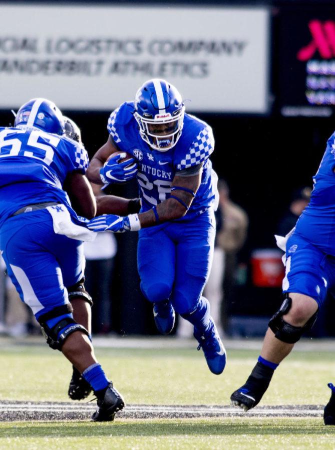 Benny Snell Jr. #26 of the Kentucky Wildcats runs with the ball down the field during the game against Vanderbilt University on Saturday, November 11, 2017 in Nashville, Tennessee. Kentucky won 44 to 21. Photo by Arden Barnes | Staff