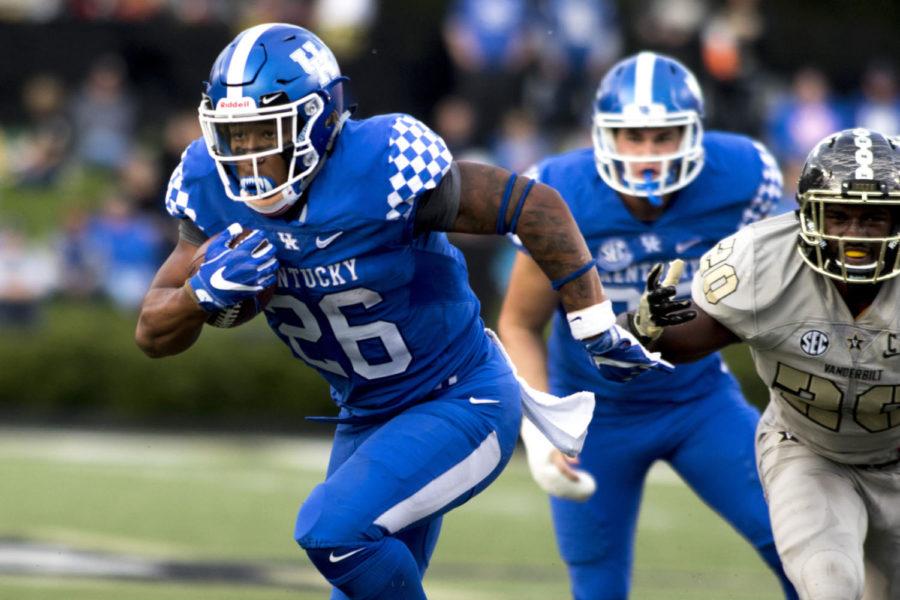 Benny Snell Jr. #26 of the Kentucky Wildcats runs to the in-zone during the game against Vanderbilt University on Saturday, November 11, 2017 in Nashville, Tennessee. Kentucky won 44 to 21. Photo by Arden Barnes | Staff