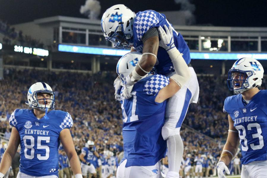 Kentucky running back Benny Snell Jr. and Kentucky tight end C.J. Conrad celebrate after a scored touchdown during the game against Ole Miss on Saturday, November 4, 2017 in Lexington, Ky.