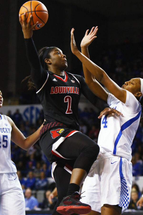 Louisville junior forward Myisha Hines-Allen shoots the ball over UK defenders during the game against Kentucky on Sunday, December 17, 2017 in Lexington, Kentucky. Kentucky was defeated 87-63. Photo by Rick Childress | Staff